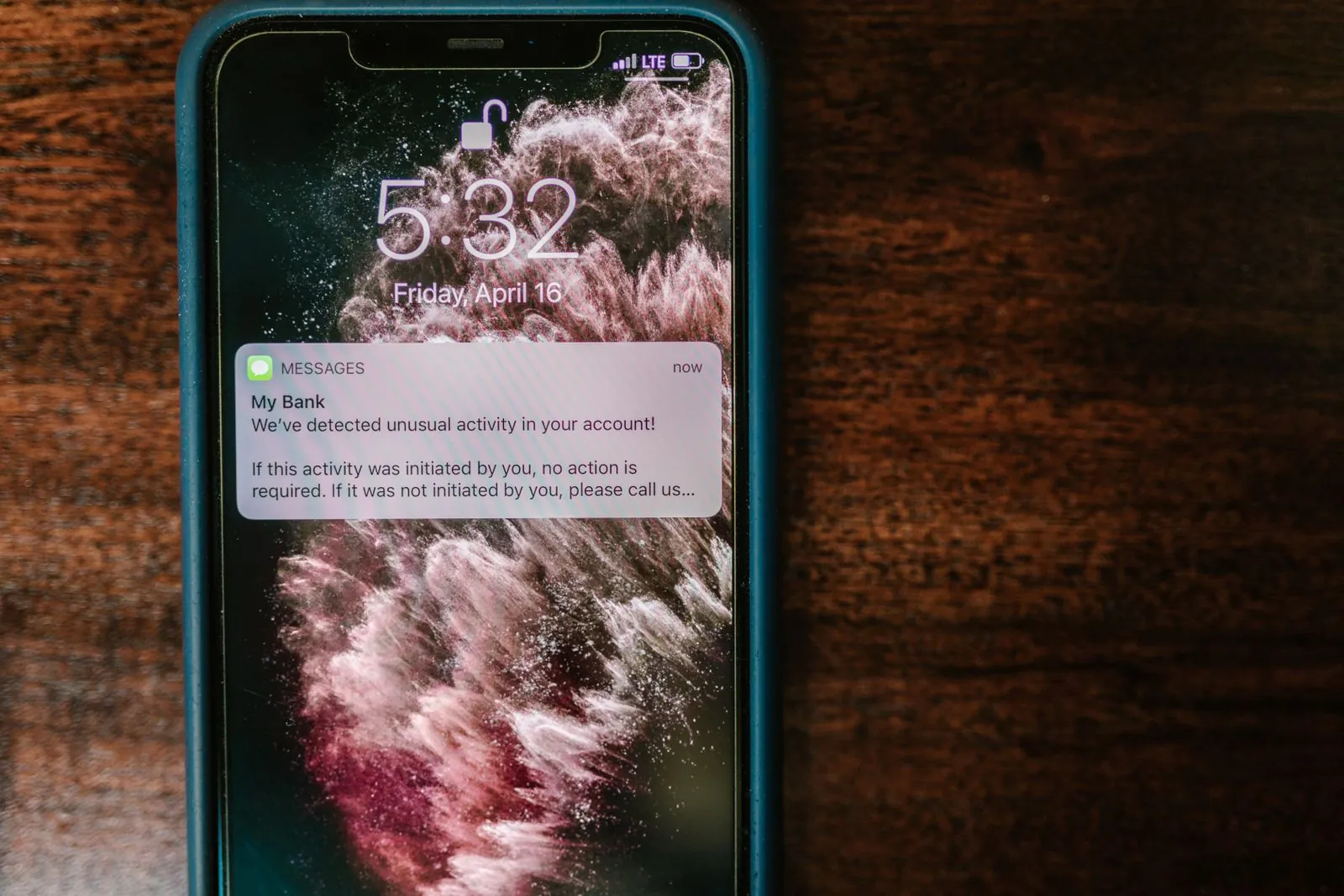 Smartphone with unread lead messages lying beside a busy clinic desk
