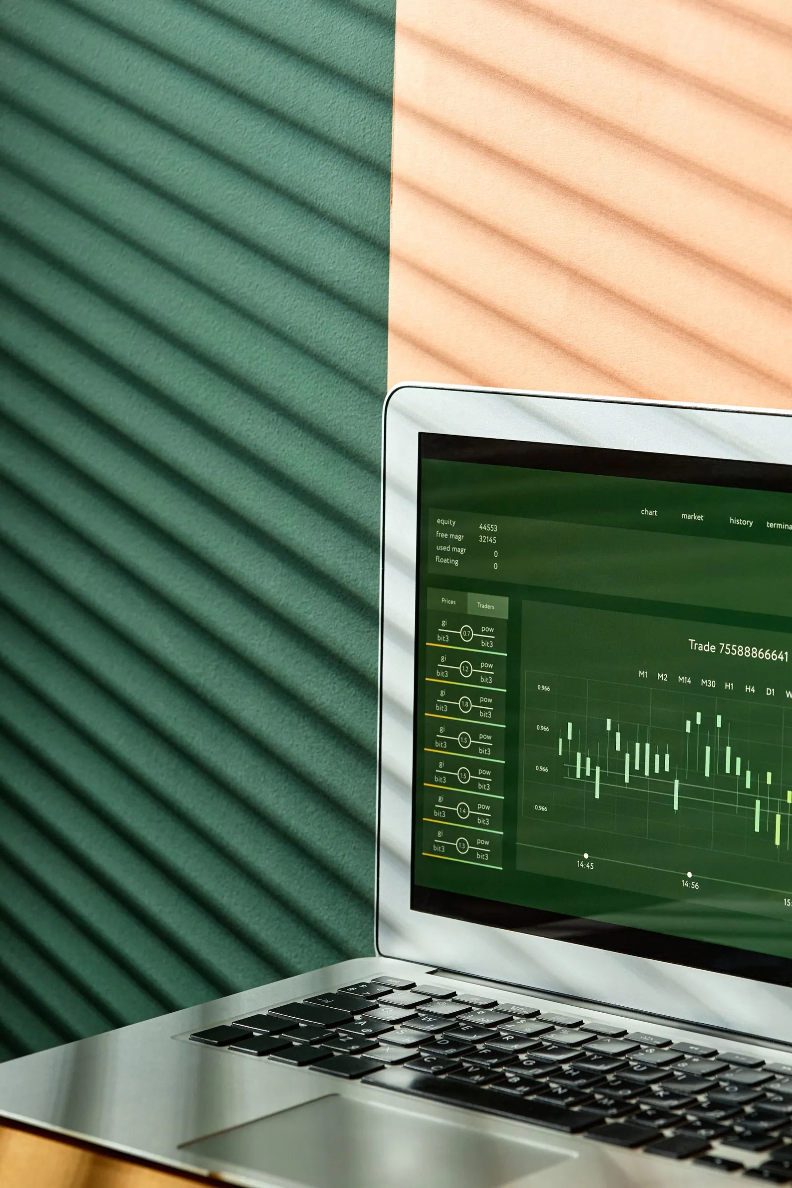 Laptop on a desk displaying business growth charts and performance metrics