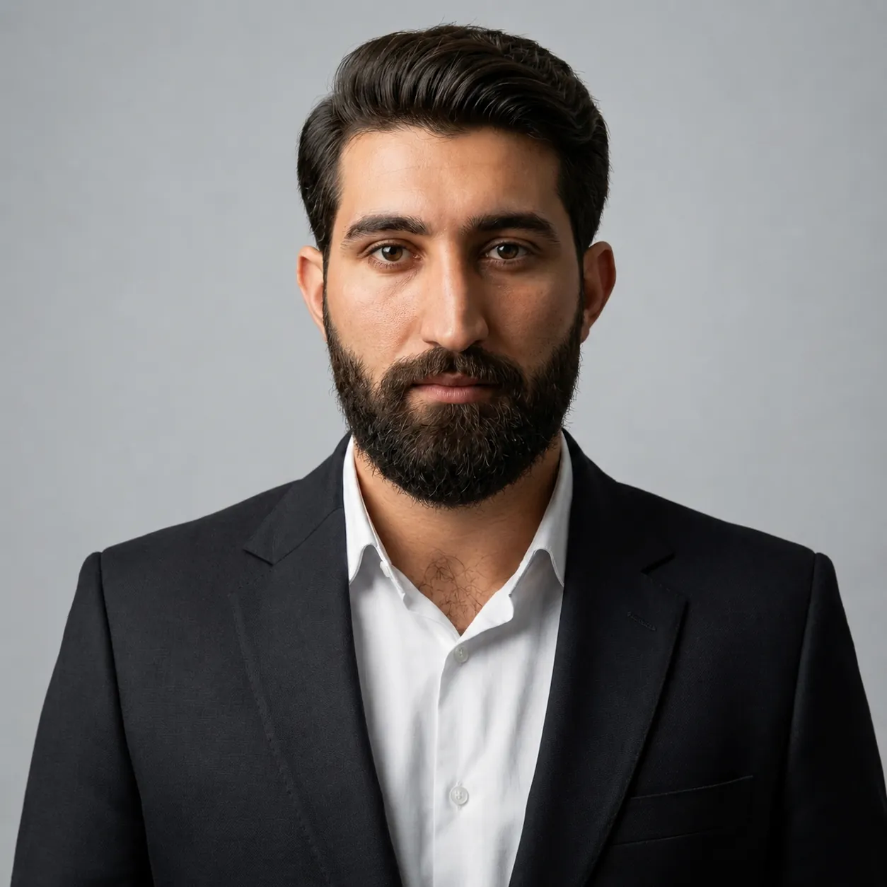 Portrait of Khalil Ur Rahman Afridi, founder of OVRIO, in a dark suit